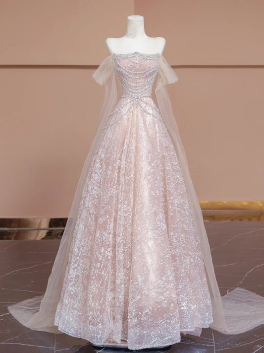 A luxurious, sweet, fairy-like, long, tulle, beaded ball gown in cherry blossom pink. nv5075