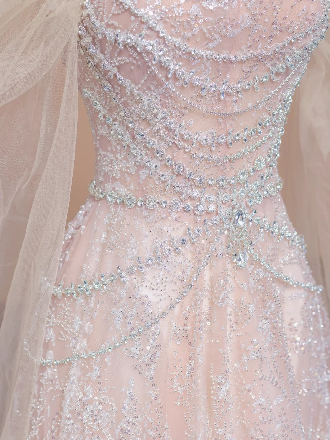 A luxurious, sweet, fairy-like, long, tulle, beaded ball gown in cherry blossom pink. nv5075